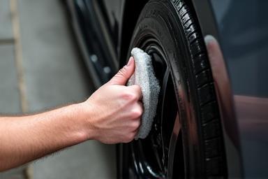 Applying tire shine.